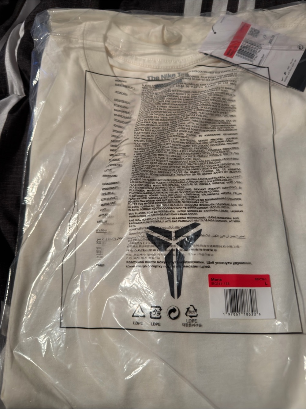 Nike Men’s White Short Sleeve Graphic Tee with Black Logo